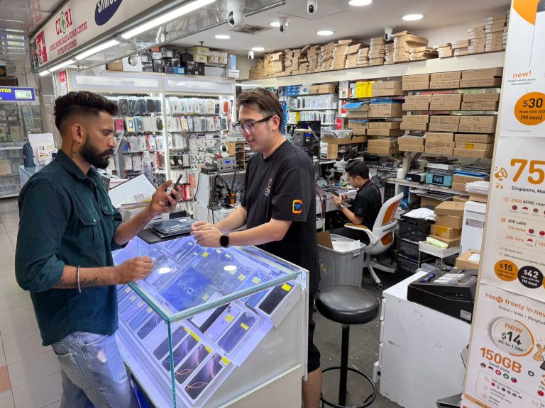 Citri Mobile staff advising a customer about Huawei Y7 Pro 2018 repair at our Singapore shop