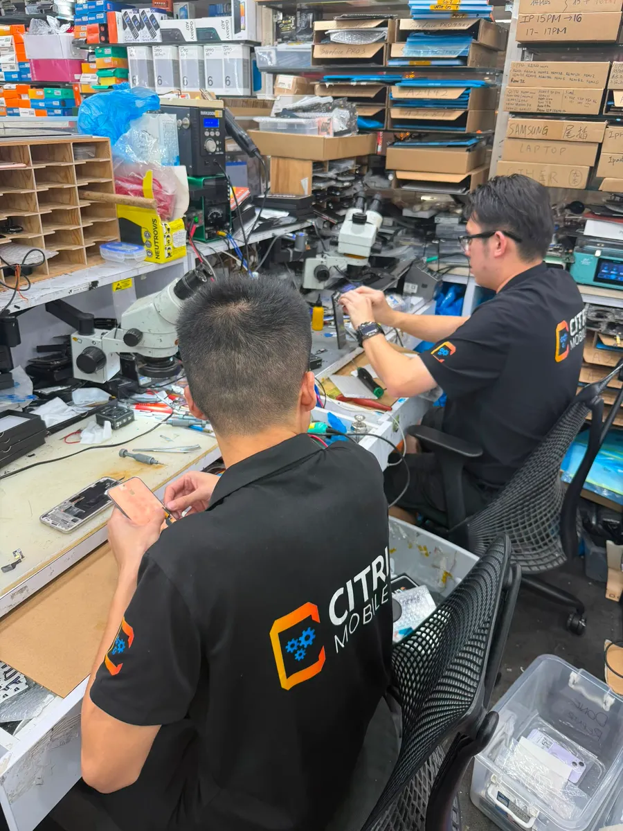 Citri Mobile technicians at the parts-stocked Xiaomi repair workshop in Chinatown (People's Park), Singapore